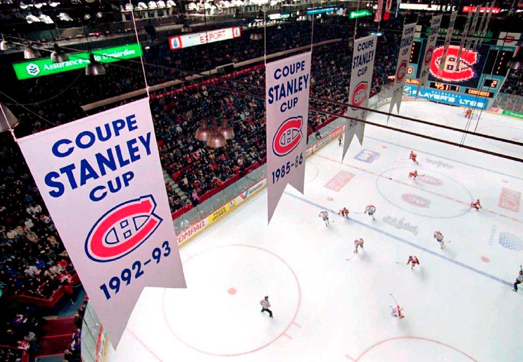 Banners hanging from the rafters of the former Montreal Forum marking the 24 Stanley Cup victories of the Canadiens, in Montreal Feb. 22, 1996.