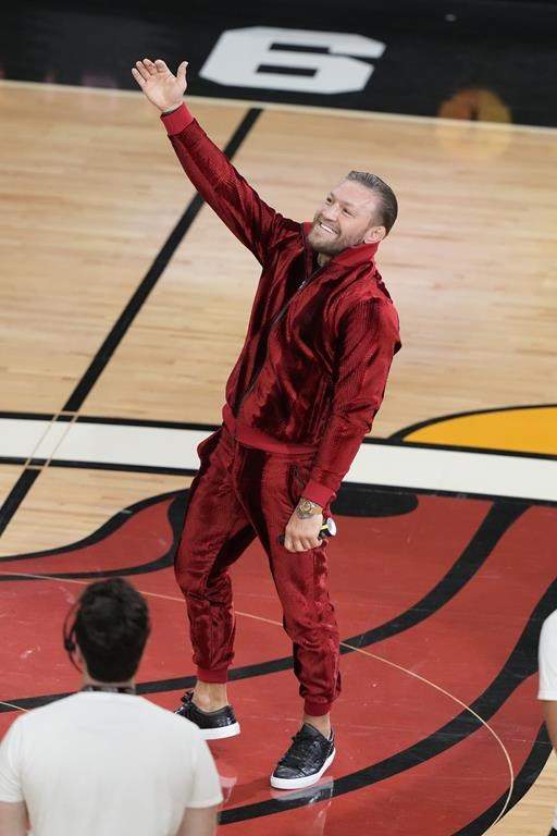 Former UFC champion Conor McGregor speaks during a break in Game 4 of the basketball NBA Finals between the Miami Heat and the Denver Nuggets, Friday, June 9, 2023, in Miami. McGregor knocked out the Miami Heat mascot in a mid-game promotion for a pain-relief spray.
