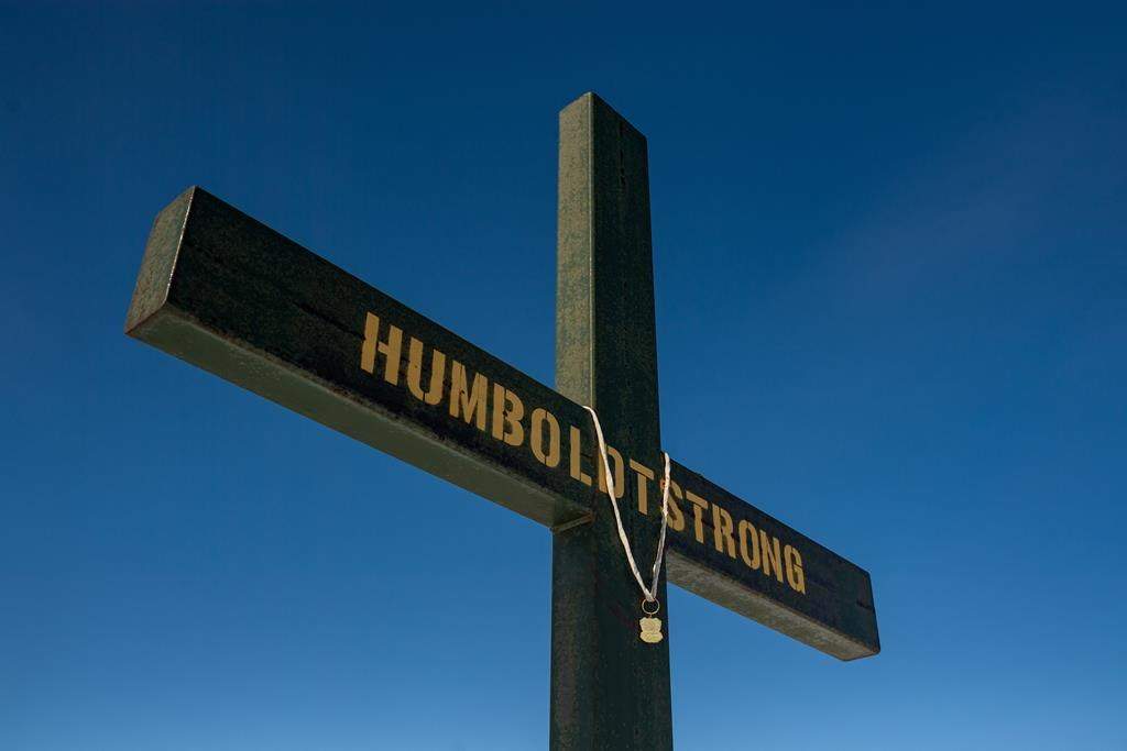 Police and community leaders in western Manitoba are looking to Saskatchewan for advice following a fatal collision that has drawn comparisons to the deadly Humboldt Broncos bus crash. A memorial on the roadside where the Humboldt Broncos bus crash took place is shown on Highway 35 near Armley, Sask., Saturday, March 18, 2023. 