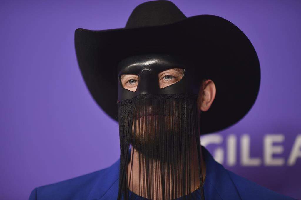 Country star Orville Peck postpones shows due to mental and physical health issues.