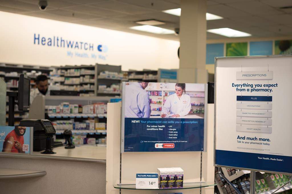 Signage explaining that Ontario pharmacists are able to provide prescriptions for minor health conditions is photographed at a Shoppers Drug Mart pharmacy in Etobicoke, Ont., on Wednesday, January 11, 2023. From self-serve lottery terminals verifying ticket buyers' ages to allowing pharmacists to administer certain injections to requiring women-only bathrooms on construction sites, a wide range of new provincial rules and regulations comes into effect Saturday. 