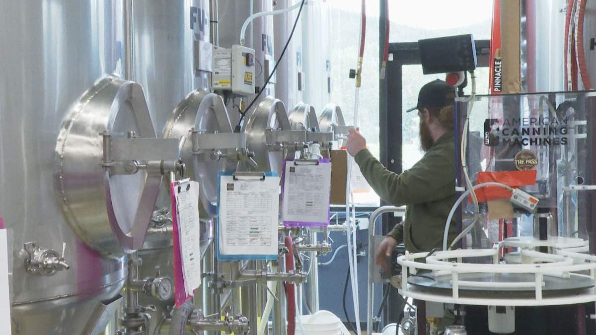 Head brewer at the Pass Beer Co., Max Rude, brewing up a new batch of their beloved craft beer.