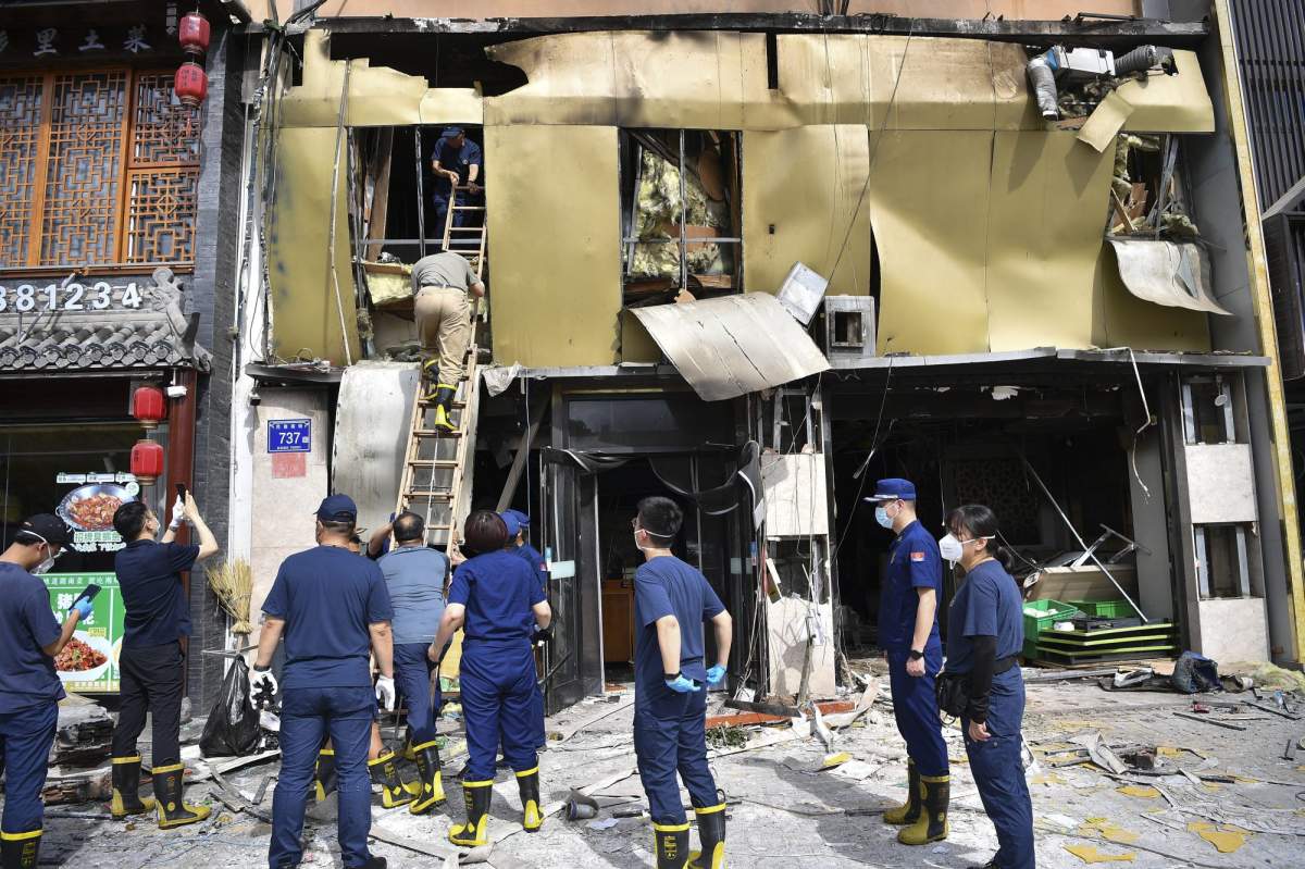 In this photo released by Xinhua News Agency, members of a team dispatched by China's Ministry of Emergency Management conduct an inspection at the site of an explosion at a restaurant in Yinchuan, northwest China's Ningxia Hui Autonomous Region, Wednesday, June 21, 2023. China's president Xi Jinping ordered a national safety campaign on Thursday after a massive cooking gas explosion at a barbecue restaurant in the northwest killed 31 people and injured seven others on the eve of a long holiday weekend. (Wang Peng/Xinhua via AP).