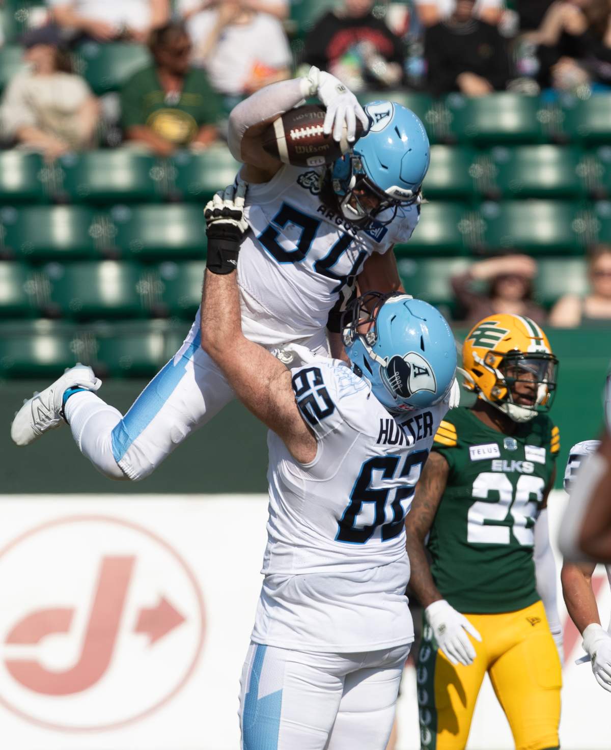 Toronto Argonauts AJ Ouellette (34) and Ryan Hunter (62) celebrate a touchdown against the Edmonton Elks during first half CFL action in Edmonton, Alta., on Sunday June 25, 2023