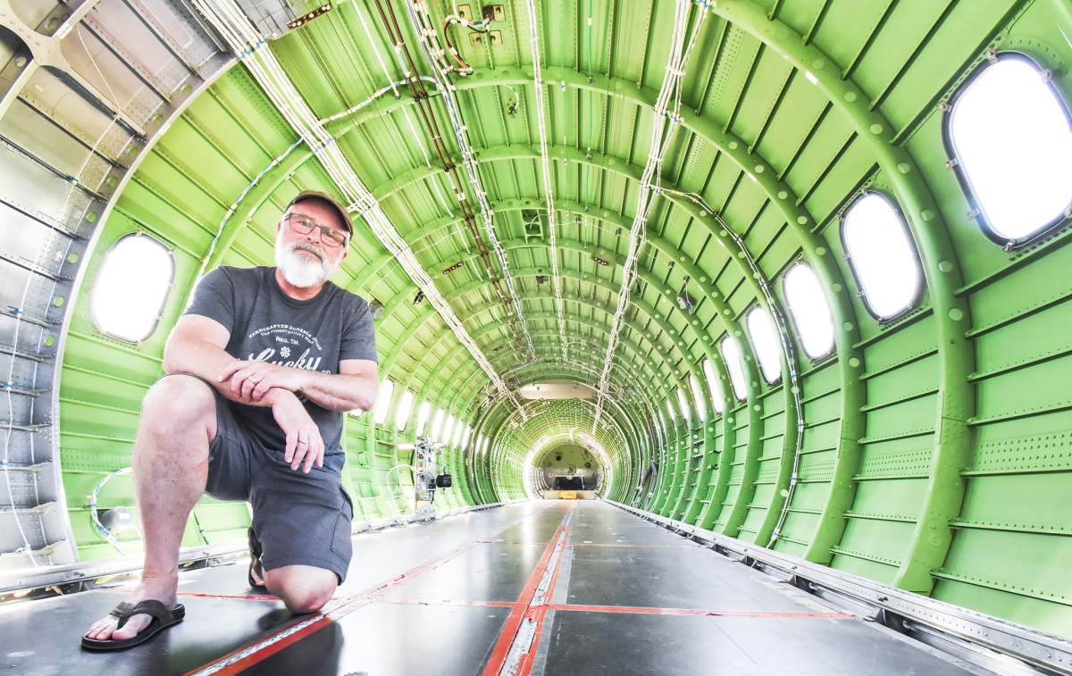 Conair Q400 airtanker pilot, Capt. Rich Tolson in the back of one of the new fire-fighting aircraft stationed at the BC Wildfire Service base at the Penticton Regional Airport.