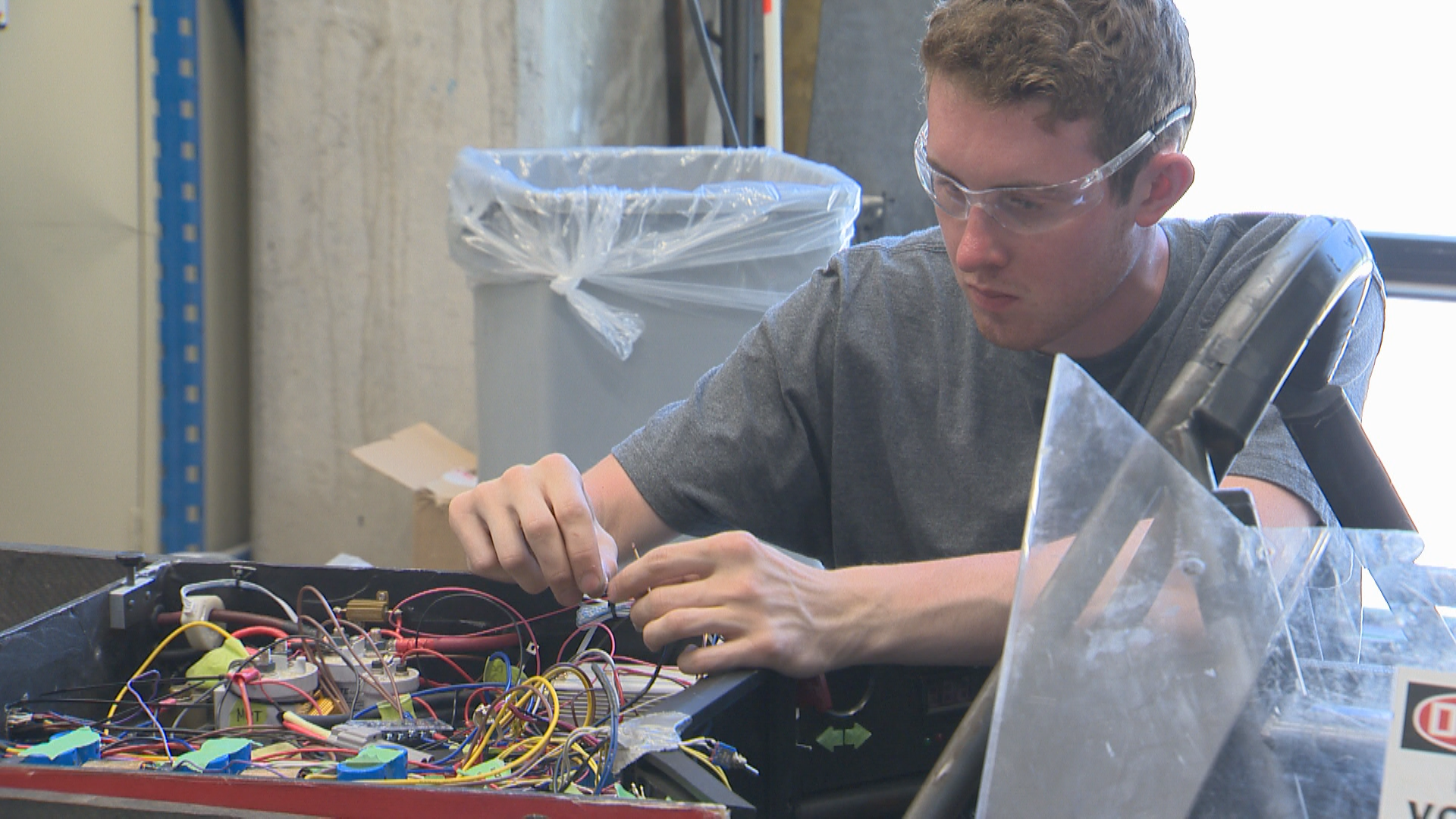 The team applies some final touches in their workshop in anticipation of their departure on Saturday morning.
