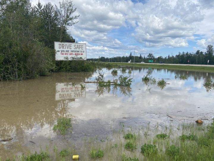 Large pools of water left by heavy rain seen in Whitecourt, Alta., on June 20, 2023.