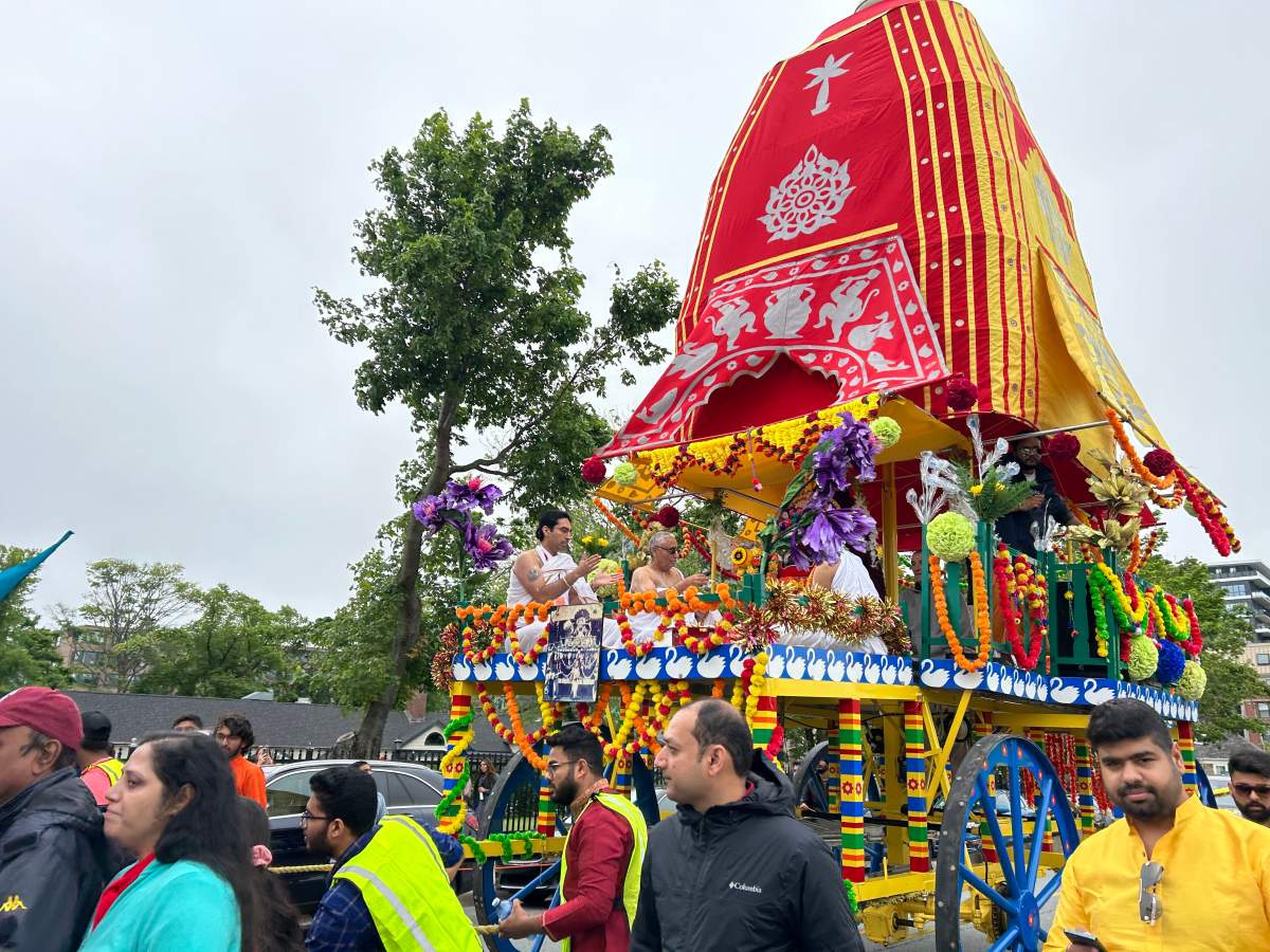 Participants surrounded the wooden chariot as it’s carried throughout the city streets.