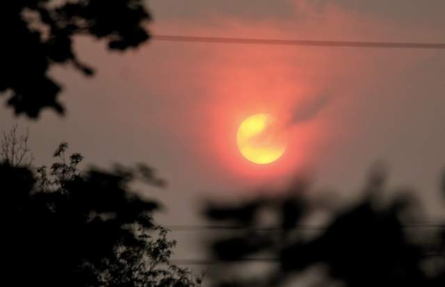The sun breaks through smoke just north of Peterborough, Ont. An air quality statement remains in effect for the region.