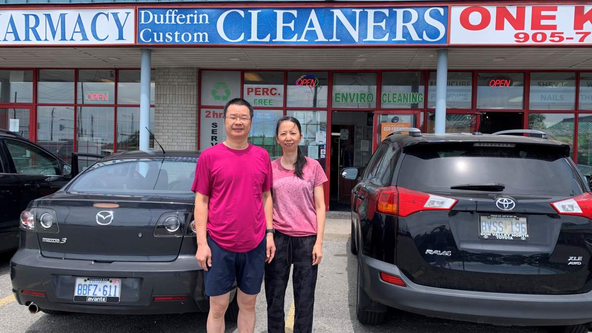 Harry and Sue Lim stand outside Dufferin Custom Cleaners, which they've run since 2003.