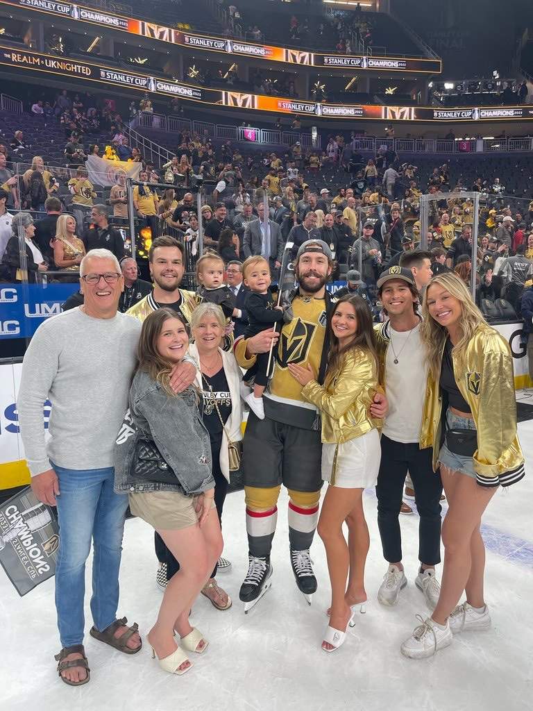 Zak Stebner and family celebrate on the ice with Golden Knights player Chandler Stephenson after the Stanley Cup win.