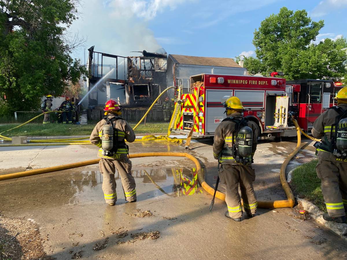 Winnipeg firefighters tackle a blaze at a vacant Pritchard Avenue house Tuesday.
