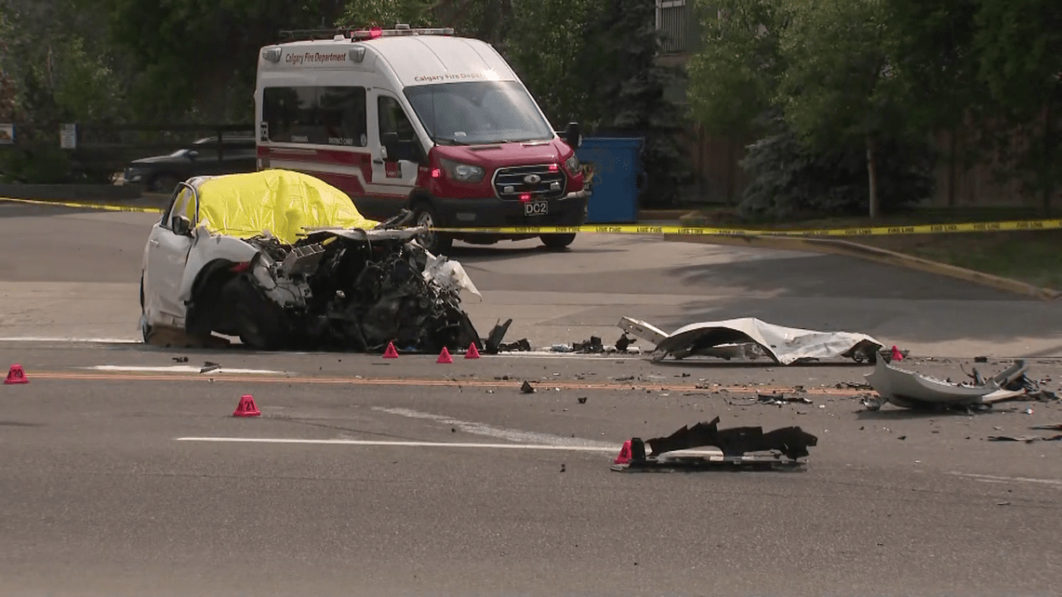 A damaged white sedan is pictured after a fatal collision in Calgary's Parkdale neighbourhood on June 9, 2023.