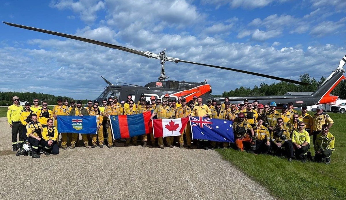 Firefighters from Alberta, Australia, the United States and elsewhere working on the Pembina Complex wildfires near Edson and in Yellowhead County on June 11, 2023.
