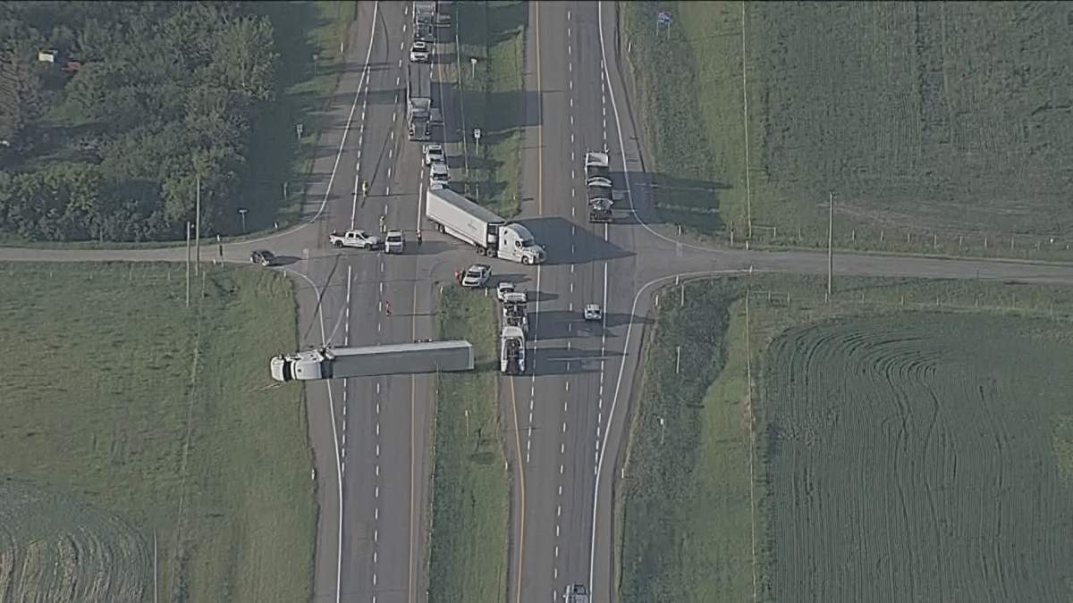 A photo of a semi-truck that rolled over on Highway 2 near High River on Wednesday June 6 2023.