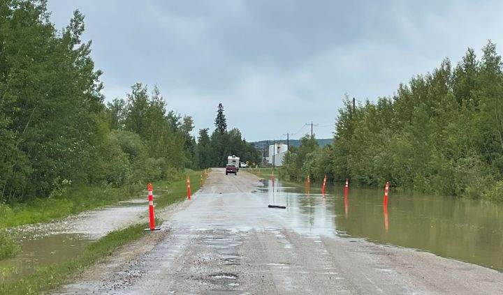 Flooding is seen at a road near the Sagitawah RV Park in Alberta on Tuesday, June 20, 2023.
