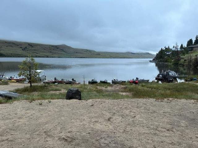 A photo of Stump Lake in B.C.’s Interior, with fishing boats lined up along the shoreline. 