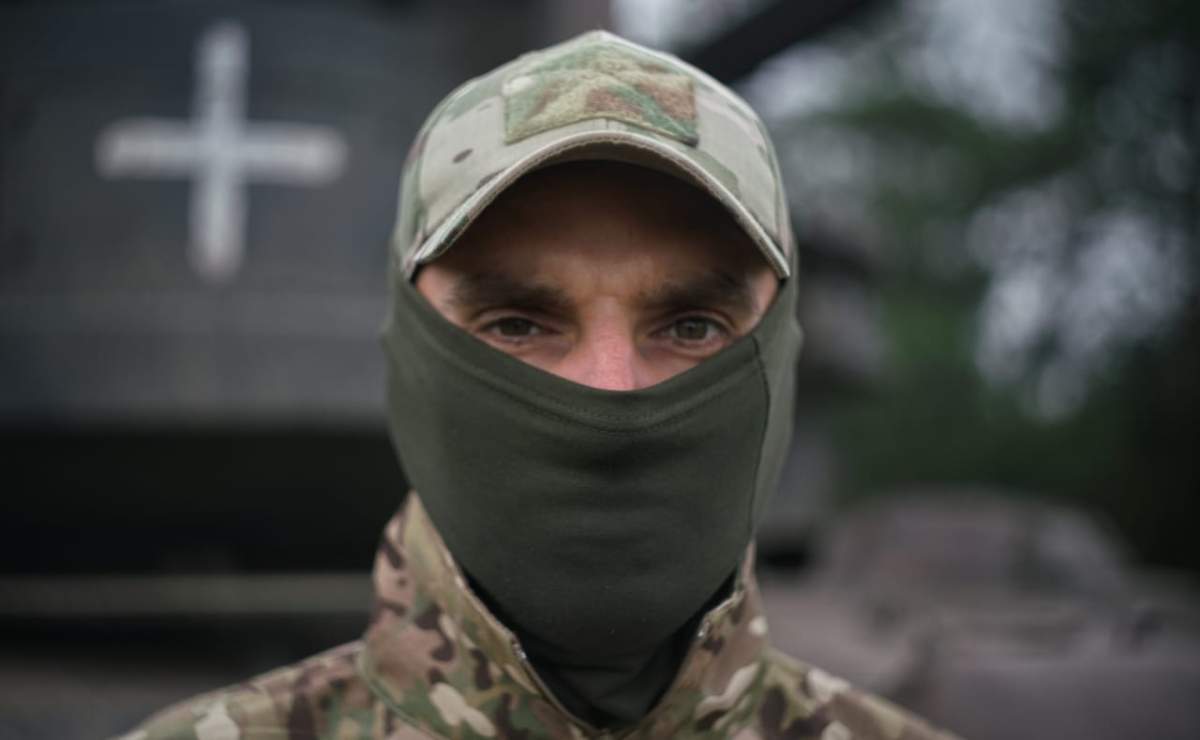 A Ukrainian member of an air defence team has his face covered.