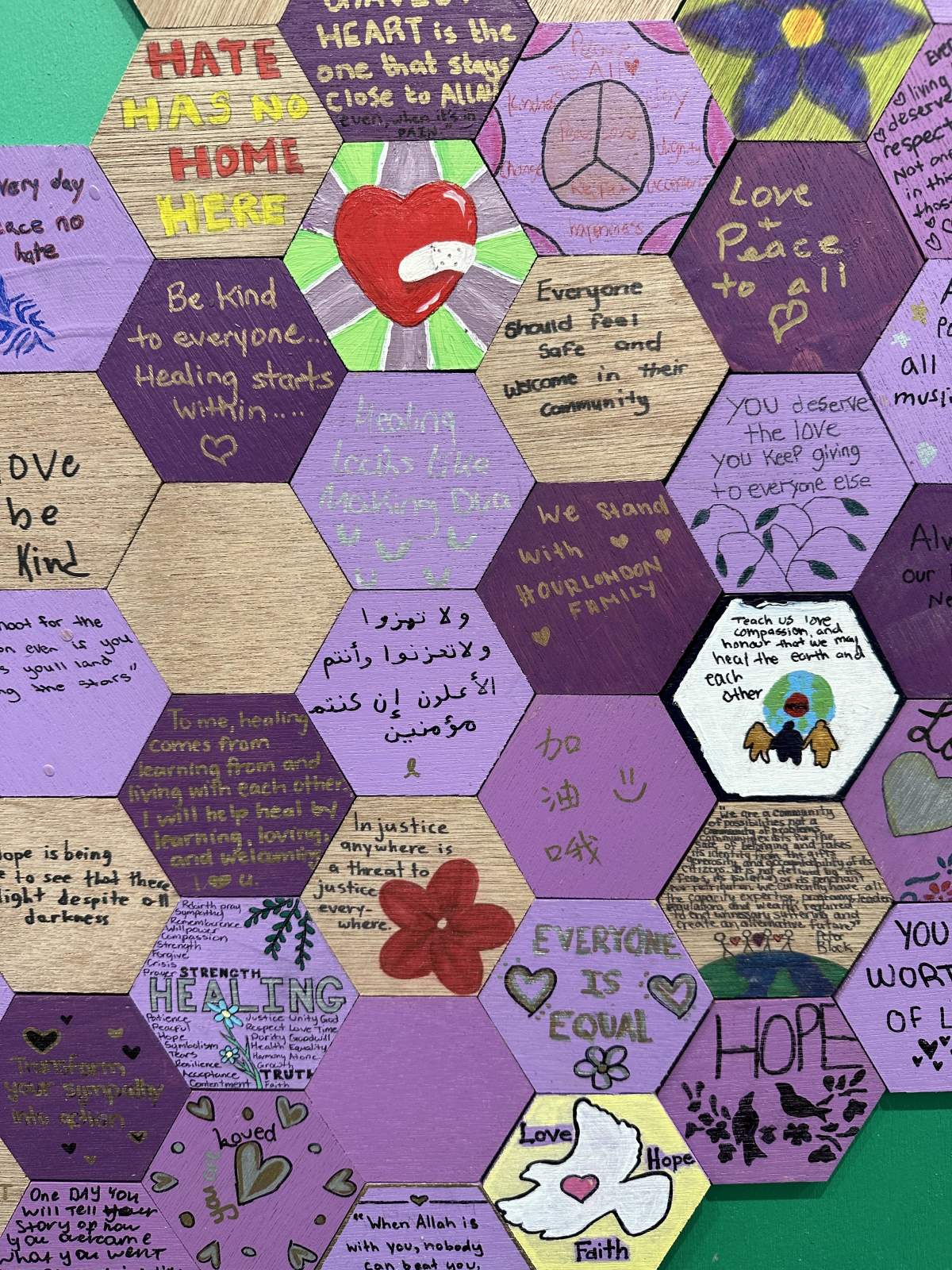 The hexagons feature messages of love, hope and remembrance written and drawn by community members.