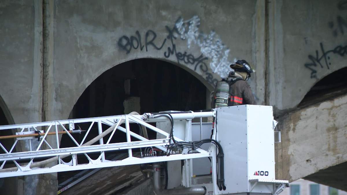 Fire crews responded to a fire early Wednesday under the University Bridge.