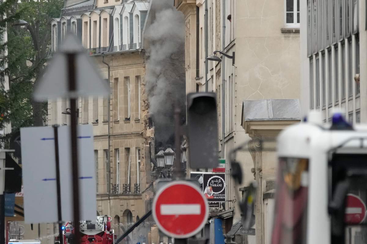 Smoke billows from a building as firemen fight a blaze Wednesday, June 21, 2023 in Paris. (AP Photo/Christophe Ena)