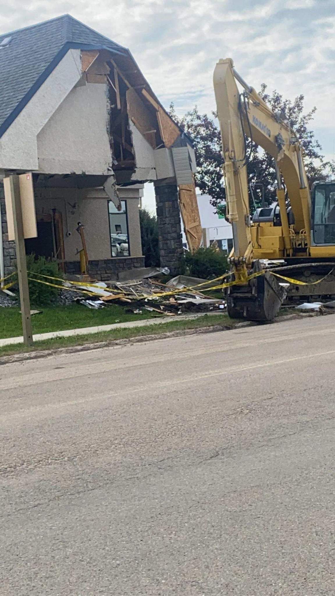 A photo of the damage that followed a person using a stolen backhoe from a nearby construction site to steal an ATM from the Rimbey Service Credit Union, Monday June 5, 2023.