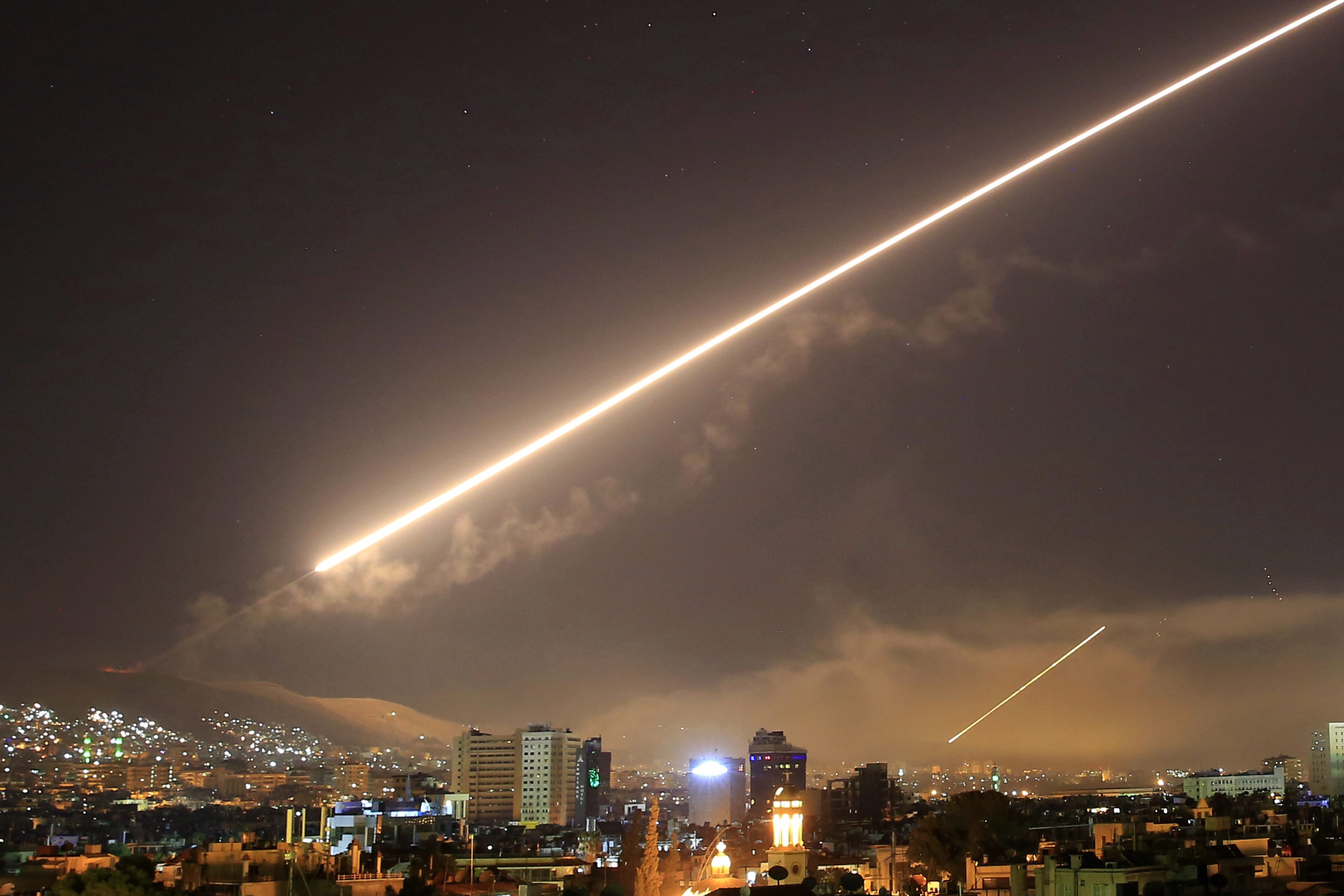 Damascus skies erupt with surface to air missile as the U.S. responds to Syrian chemical weapons attack, April 14, 2018. (AP Photo/Hassan Ammar).