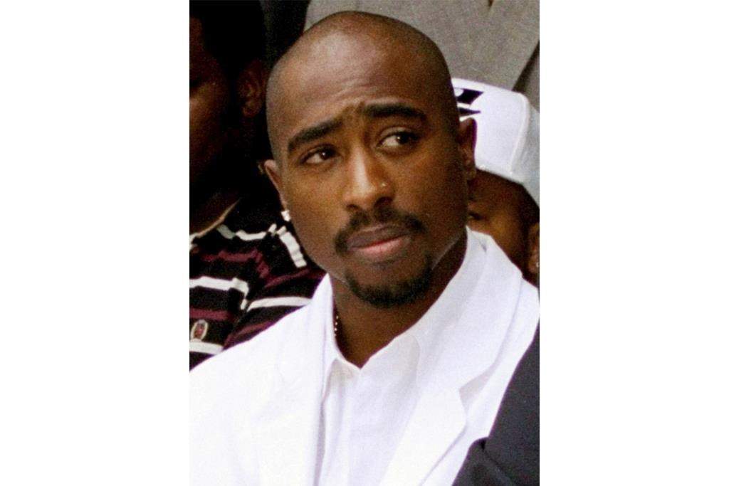 FILE - Rapper Tupac Shakur attends a voter registration event in South Central Los Angeles, Aug. 15, 1996.