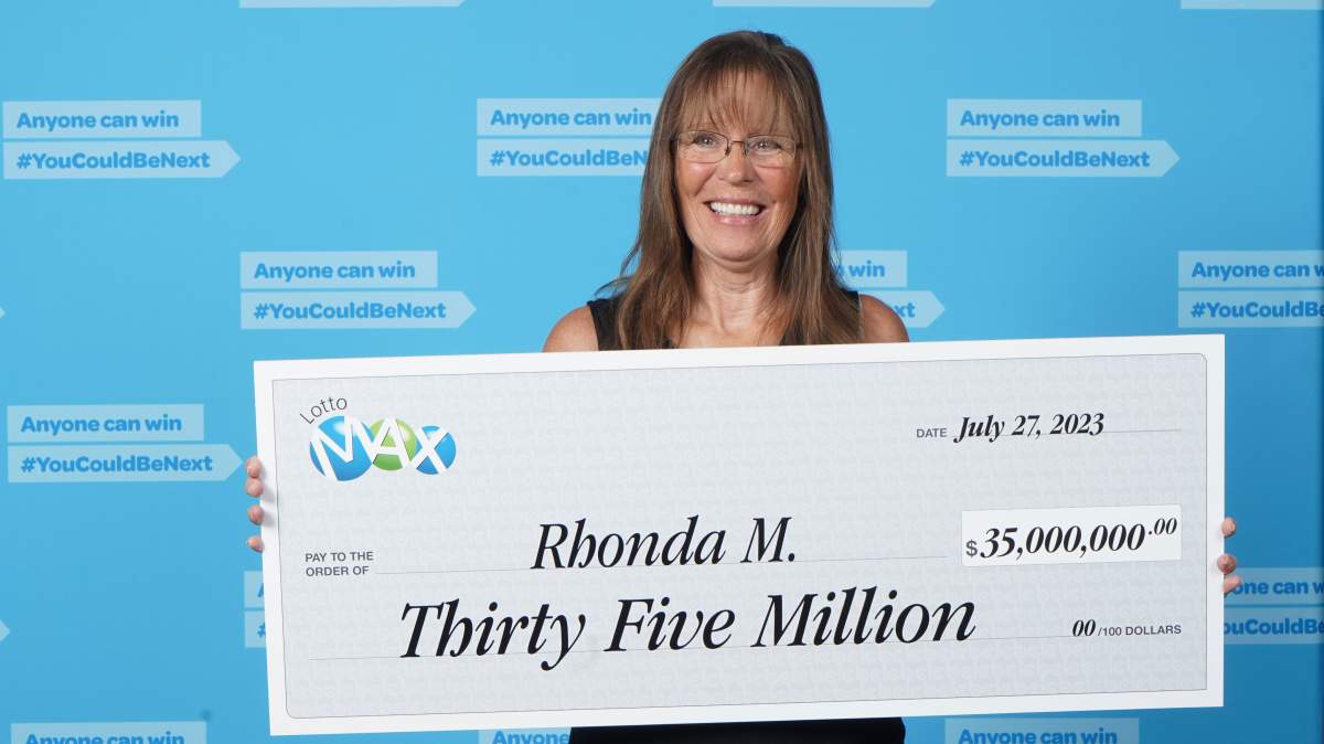 Rhonda Malesku of Kamloops, B.C., with a presentation cheque worth $35 million on Thursday, July 27, 2023. Malesku matched all seven numbers in Tuesday night’s Lotto Max draw and split the $70 million jackpot with another winning ticket in Alberta.