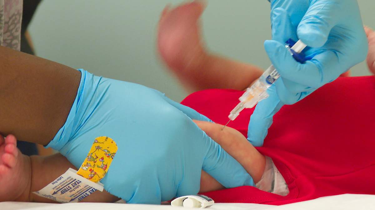 An infant receives a routine vaccination at First Georgia Physician Group Pediatrics in Fayetteville, Ga., Tuesday, Aug. 17, 2021.