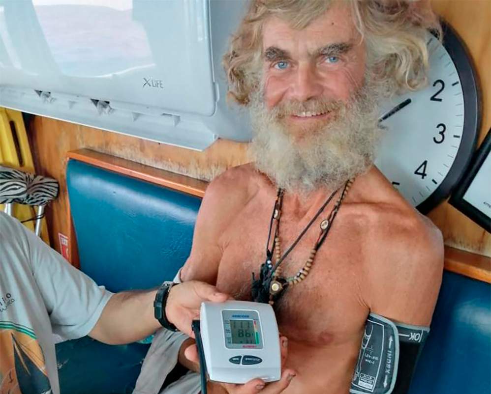 In this photo provided by Grupomar/Atun Tuny, Australian Tim Shaddock has is blood pressure taken after being rescued by a Mexican tuna boat in international waters, after being adrift with his dog for three months. Haddock and his dog Bella were aboard his incapacitated catamaran Aloha Toa some 1,200 miles from land when they were rescued.