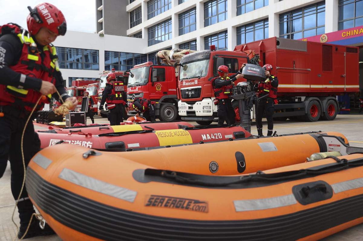 In this photo released by Xinhua News Agency, firefighters check on rescue boats as they prepare for Typhoon Doksuri in Haicang District of Xiamen in southeast China’s Fujian Province on July 26, 2023. The coastal Chinese city of Shantou on Thursday joined parts of Taiwan in shutting down schools and offices as Typhoon Doksuri brings heavy wind and rain to the Taiwan Strait and surrounding areas. ( Zeng Demeng/Xinhua via AP)