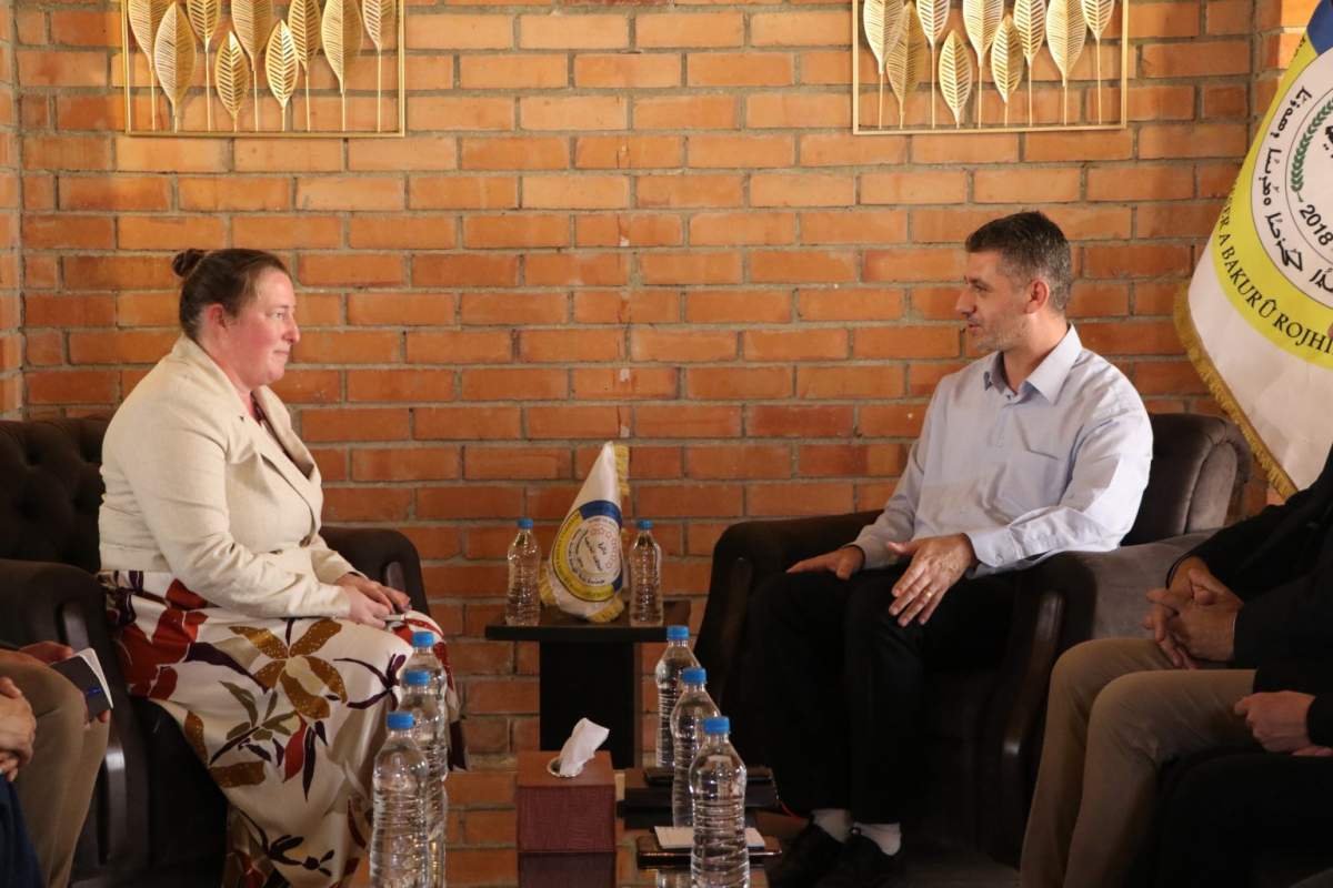 Photo released by administration that controls northeast Syria meeting Canadian delegation (left) before handing over five Canadian citizens detained during the war against ISIS.