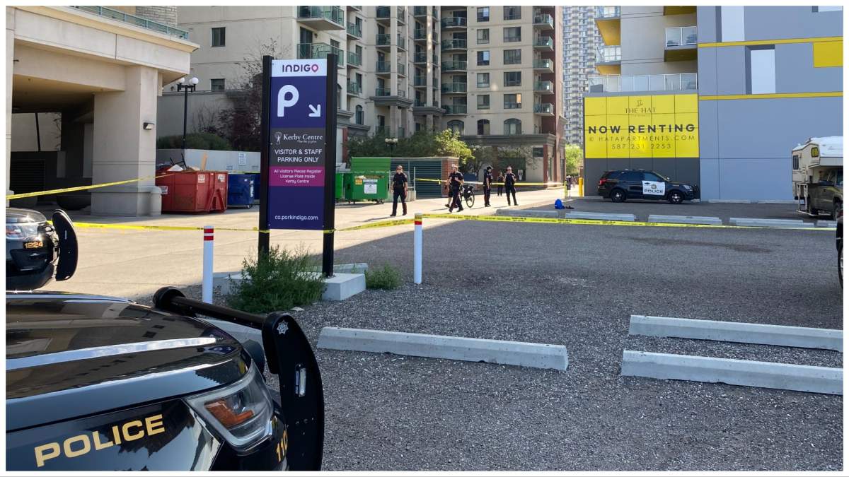 CPS members and police tape near a parking lot in the 1100 block of Seventh Avenue Southwest on July 10 after a man suffering from a gunshot wound was found.