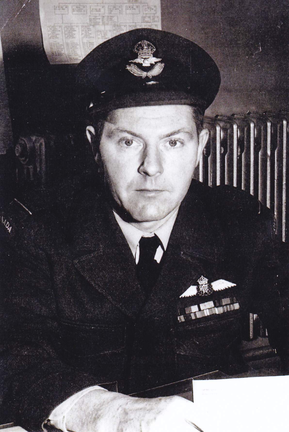 Gordon Gibson, a pilot in World War Two posing in uniform.