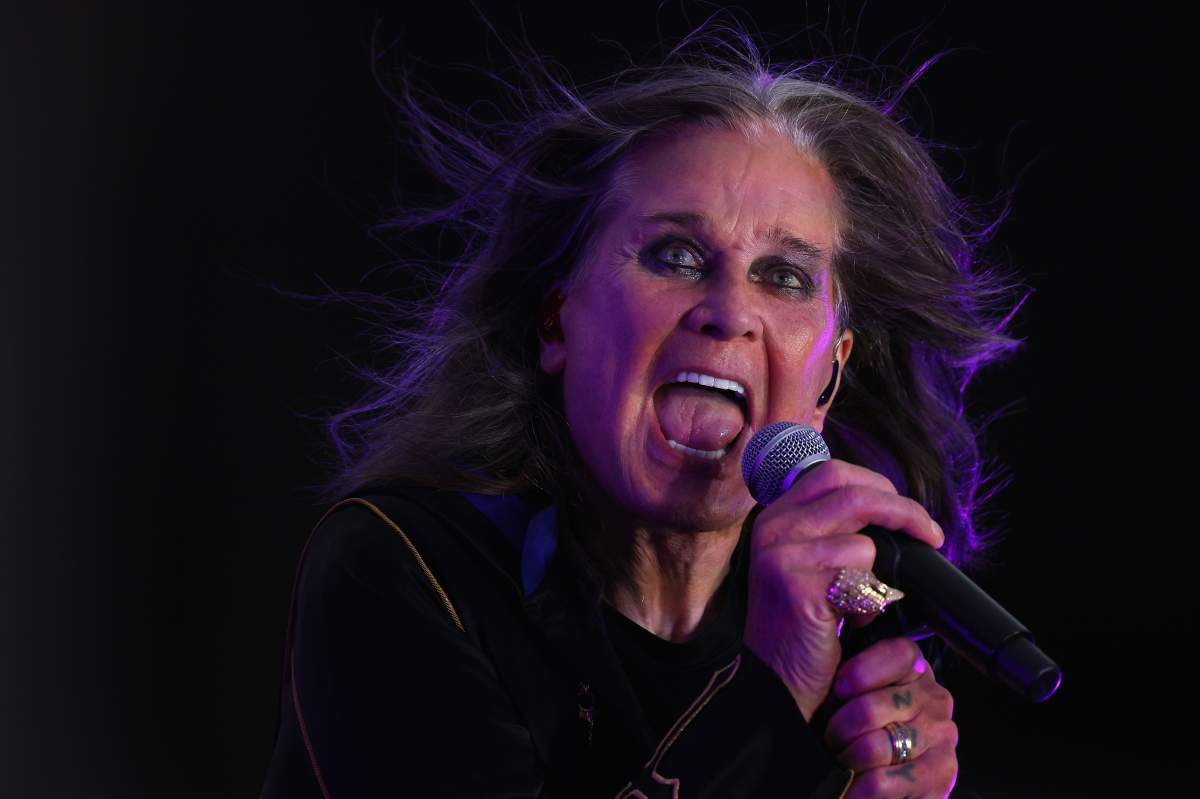 Ozzy Osbourne singing into a microphone.