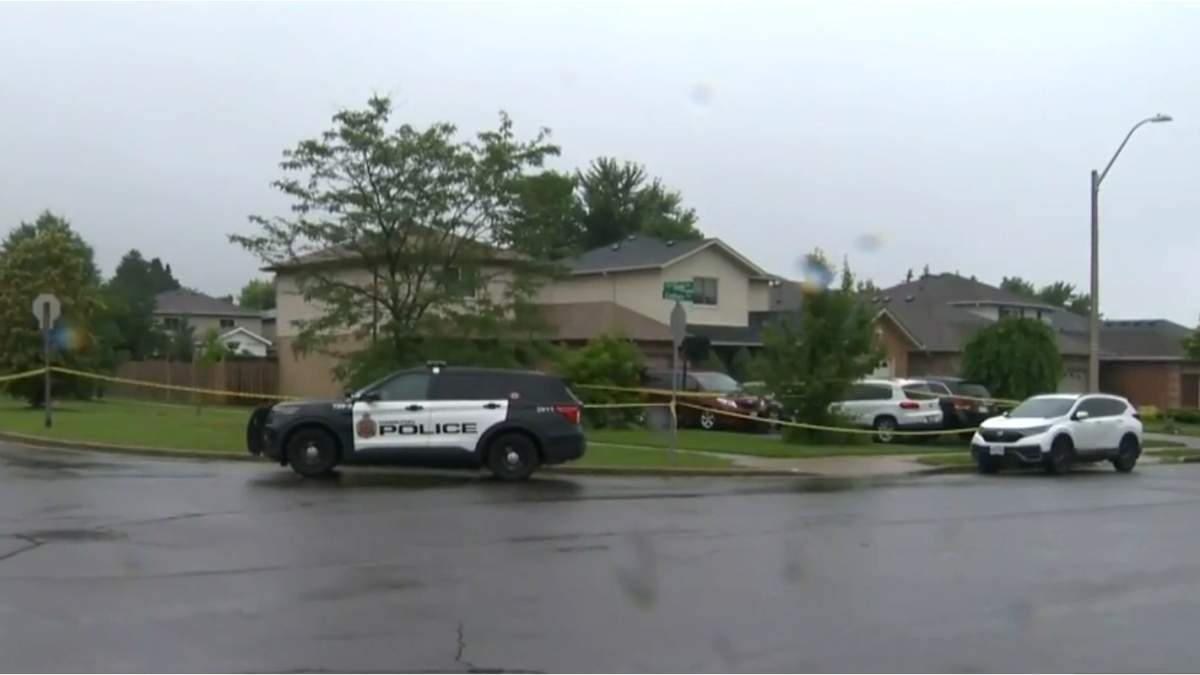 Hamilton Police on location at a residence on Cadham Boulevard following the discovery of a 16-year-old male victim who had been stabbed at a family gathering.