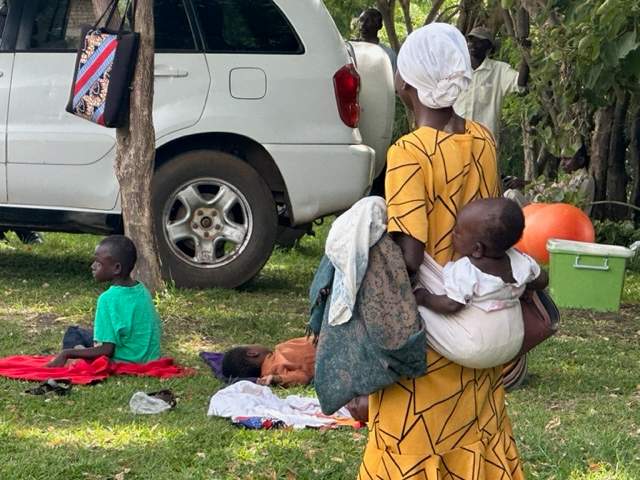 A Ugandan mother carried her visually impaired daughter for nearly an hour over steep terrain to attend an outreach clinic partially funded by Embrace.