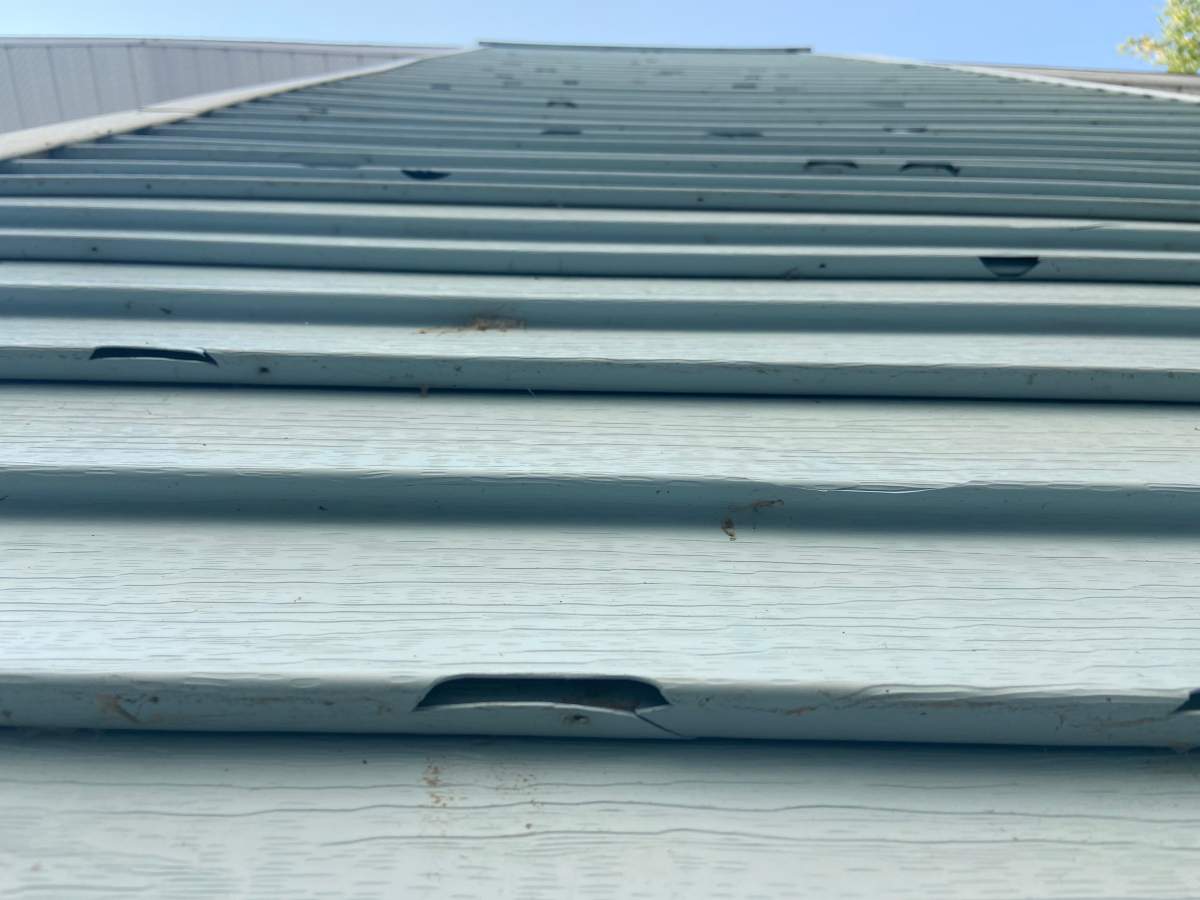 Hail damaged the siding of Luft’s home.