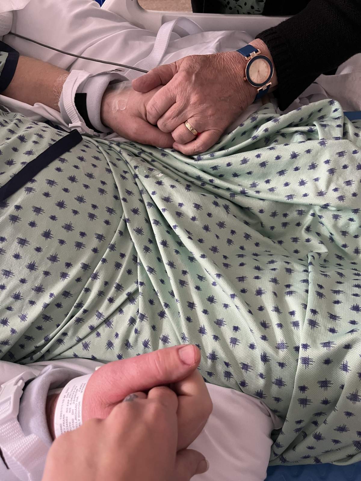 Whiteley's family grips onto his hands tightly during his hospital stay.
