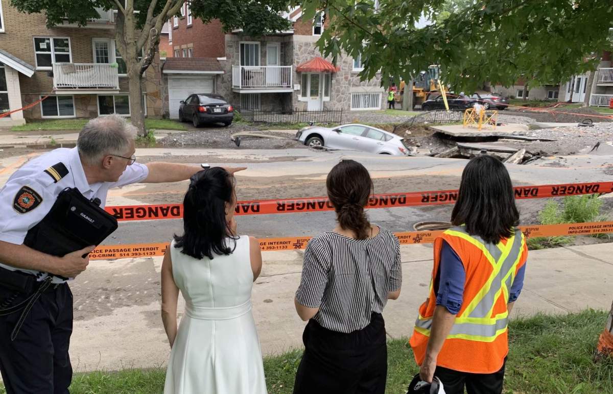 Montreal Mayor Valérie Plante was onsite Friday (second left) with emergency crews.