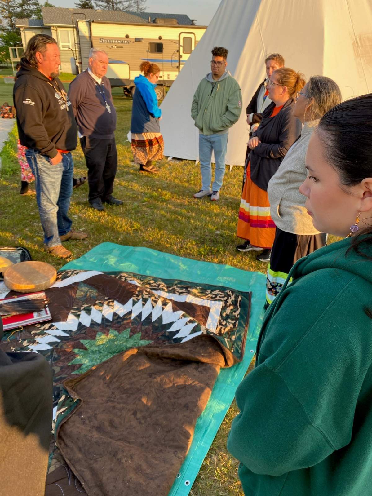 Chief Derek Nepinak (top left) speaks with anthropology team from Brandon University who will do the search starting Tuesday.