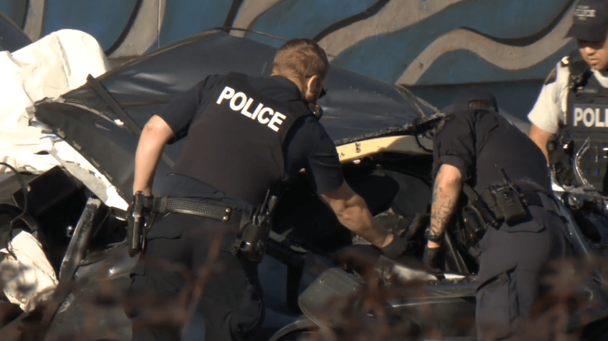 Police investigate the wreckage of a fatal crash in Burnaby on Wed. July 19, 2023.
