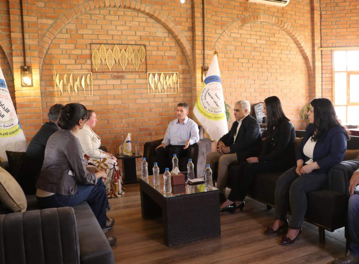 Photo released by administration that controls the Kurdish-majority northeast region of Syria shows visit by Canadian delegation, left, before handover of five Canadian detainees.