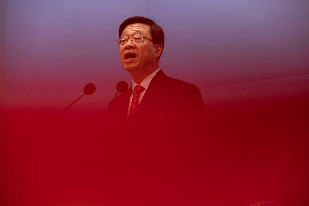 FILE – Hong Kong Chief Executive John Lee speaks during a news conference in Hong Kong, March 21, 2023. Lee said Tuesday, July 4, that eight pro-democracy activists who now live in the United States, Britain, Canada and Australia will be pursued for life for alleged national security offenses, dismissing criticism that the move to have them arrested was a dangerous precedent. (AP Photo/Louise Delmotte, File)