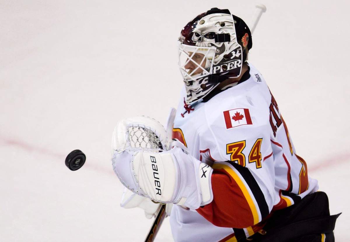 Calgary Flames goalie Miikka Kiprusoff, of Finland, makes a save against the Vancouver Canucks during the second period of an NHL hockey game in Vancouver, B.C., on Saturday April 6, 2013. 