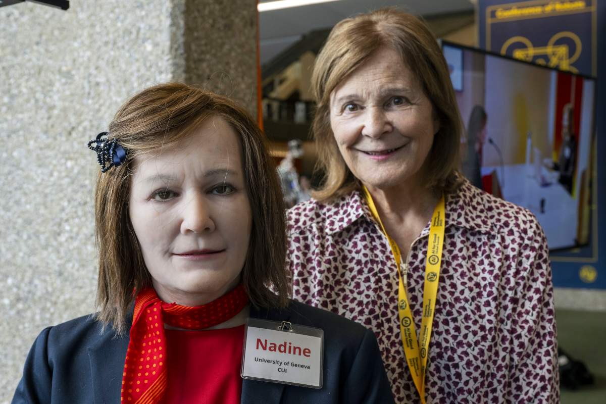 Nadia Thalmann, right, from the University of Geneva poses next to Humanoid robot Nadine during the ITU’s AI for Good Global Summit in Geneva, Switzerland, Wednesday, July 5, 2023.