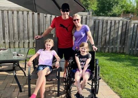 Grace Anstey, 9, with her family recovering after dislocating her knee.