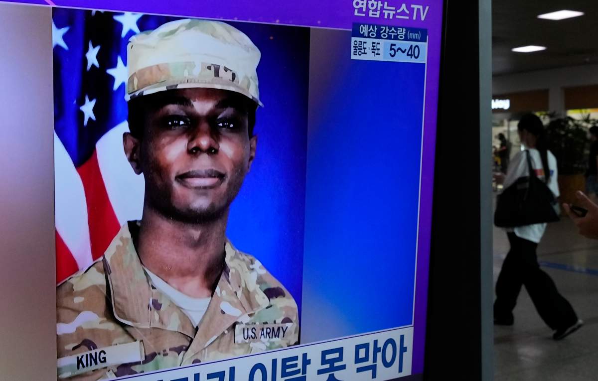 A TV screen shows a file image of American soldier Travis King during a news program at the Seoul Railway Station in Seoul, South Korea, Monday, July 24, 2023.  (AP Photo/Ahn Young-joon)