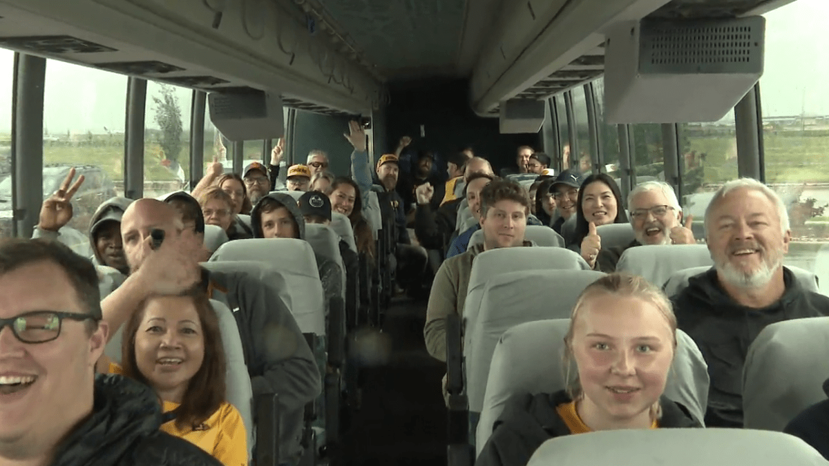 Fans of the Edmonton Stingers on board a bus to Calgary to cheer on the team in the penultimate game of the season, July 26, 2023.